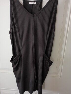 Black Ribbed V-Neck Sleeveless Shorts with Pockets. 90% Polyester 10% Spandex